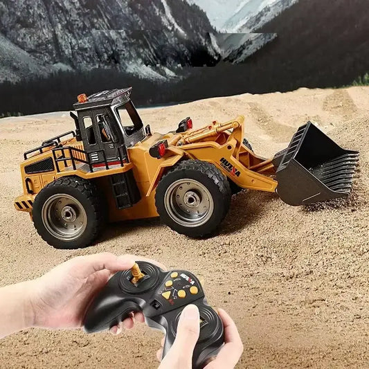 HUINA 118 RC Bulldozer remote control vehicle operating in sand with controller in hand.