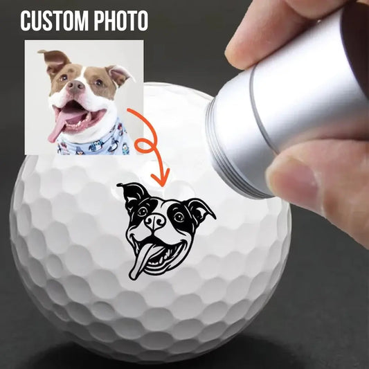 Custom Golf Ball Stamp featuring a personalized pet face design and custom photo being applied to a golf ball.