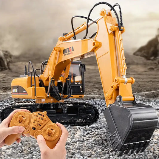 Huina 535 RC Excavator being controlled remotely with a joystick on gravel terrain.