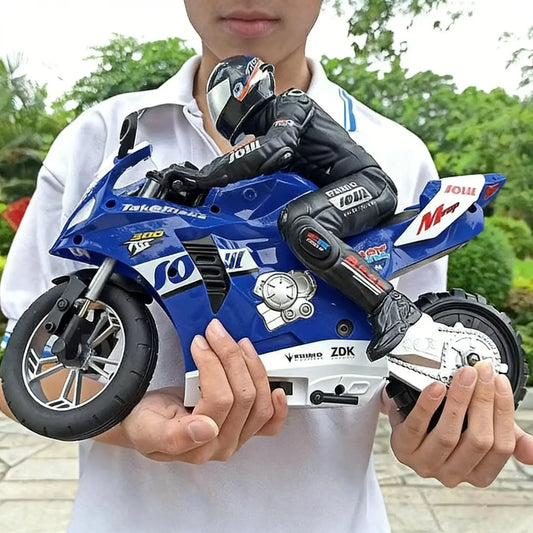 RC Motorcycles model held by a person, showcasing detailed design and realistic features in a garden setting.
