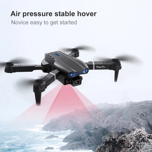 Foldable dual camera FPV drone in stable hover mode over rocky landscape, showcasing user-friendly features.