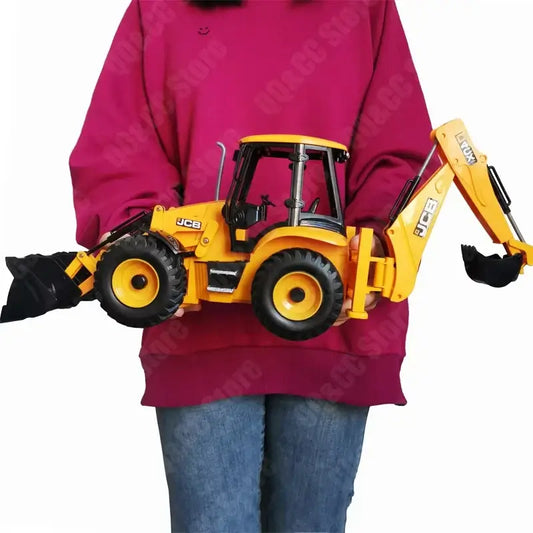 RC excavator remote control held by a person, showcasing a detailed yellow JCB model with functional features.