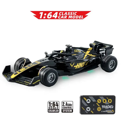 Mini RC F1 racing car with remote control, 1/64 scale model, sleek black and yellow design.