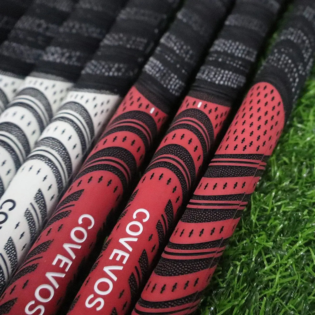 Golf rubber grip variety displayed on grass surface, featuring non-slip and wear-resistant designs.