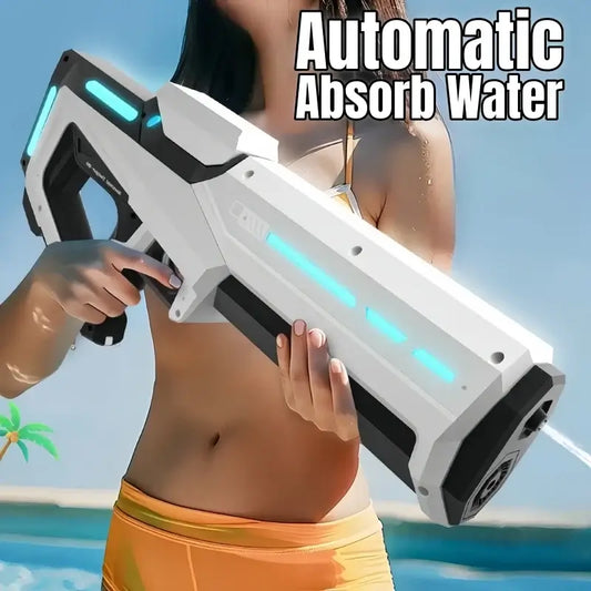 Person holding 42cm Electric Water Guns with automatic absorb water feature in a sunny outdoor setting.