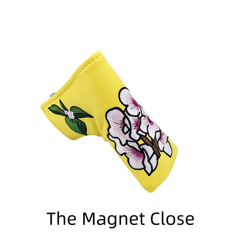 Flower embroidery golf club head covers in yellow with floral design and soft interior lining.