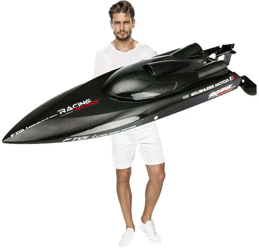 Large RC Speed Boat FT011 FT012 FT016 WL916 held by a man, showcasing its sleek design and racing capabilities.