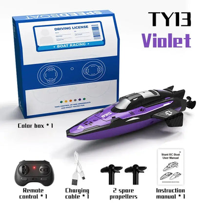 RC Racing Speedboat Mini Remote Control Stunt Boat with purple design and accessory components in packaging.