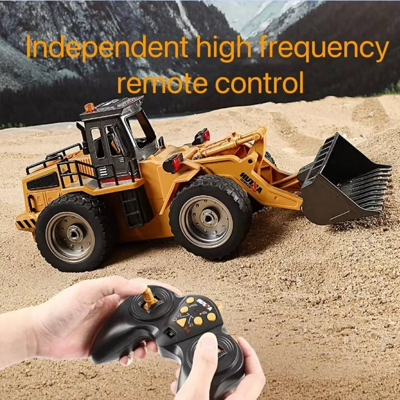 HUINA 1560 RC bulldozer with remote control on sand, showcasing its independent high frequency capabilities