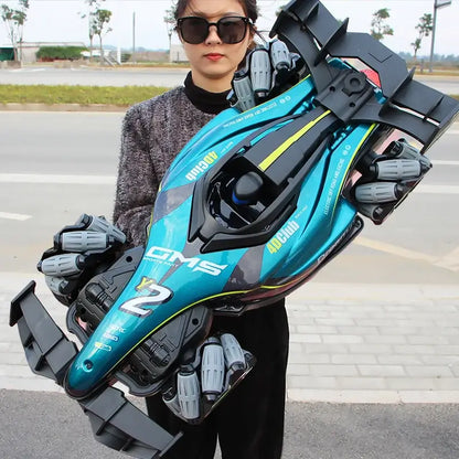Person holding Y2 RC Car Drift Car with Light showing its sleek design and detailed features outdoors.