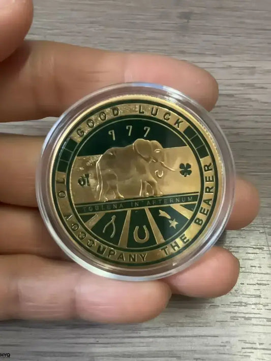 four leaf clover commemorative coin featuring an elephant design with lucky symbols and the text 'GOOD LUCK'