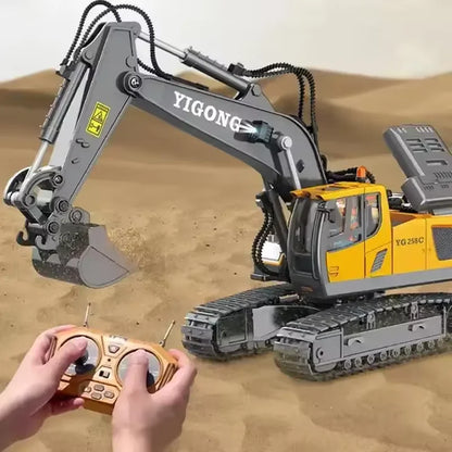 remote control excavator dump truck in action with a remote controller in hands on a sandy surface.
