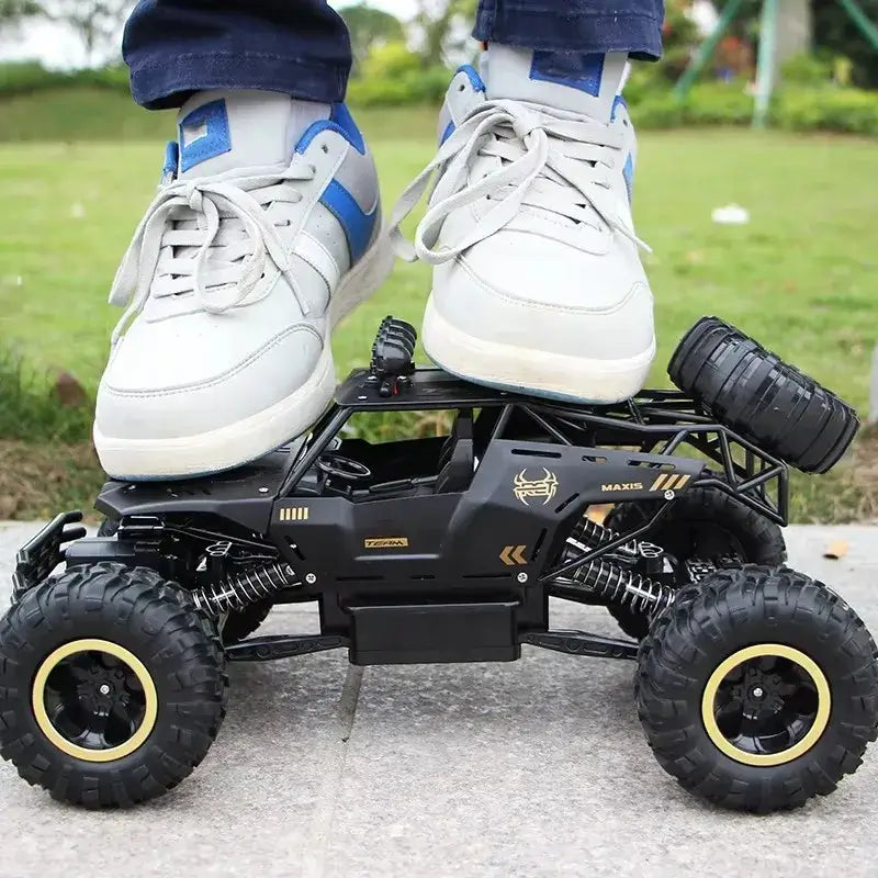 RC Car Remote Control Climbing Vehicle underfoot, showcasing its durable design and all-terrain capabilities.