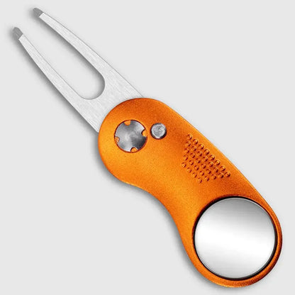 Metal Foldable Golf Divot Repair Tool in orange color with stainless steel prongs and built-in ball marker.