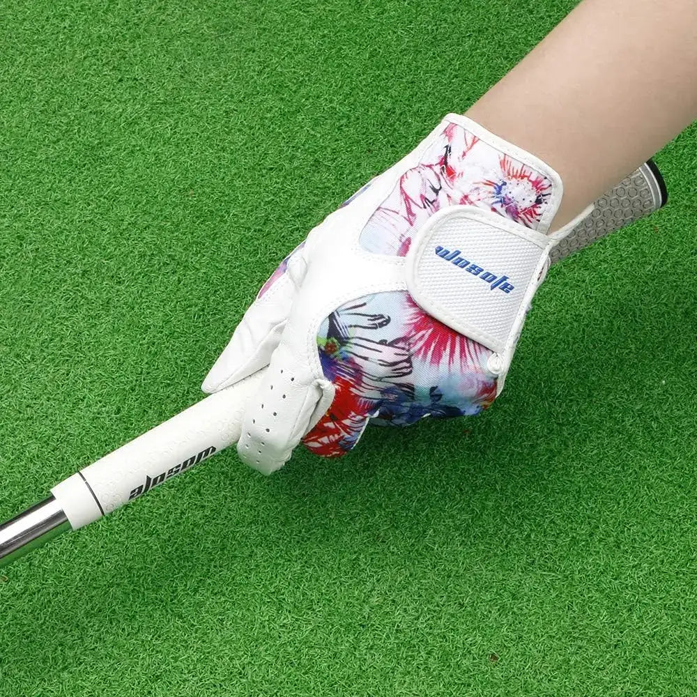 Golf Glove Women Ladies Pair on a hand gripping a golf club with a vibrant floral design.