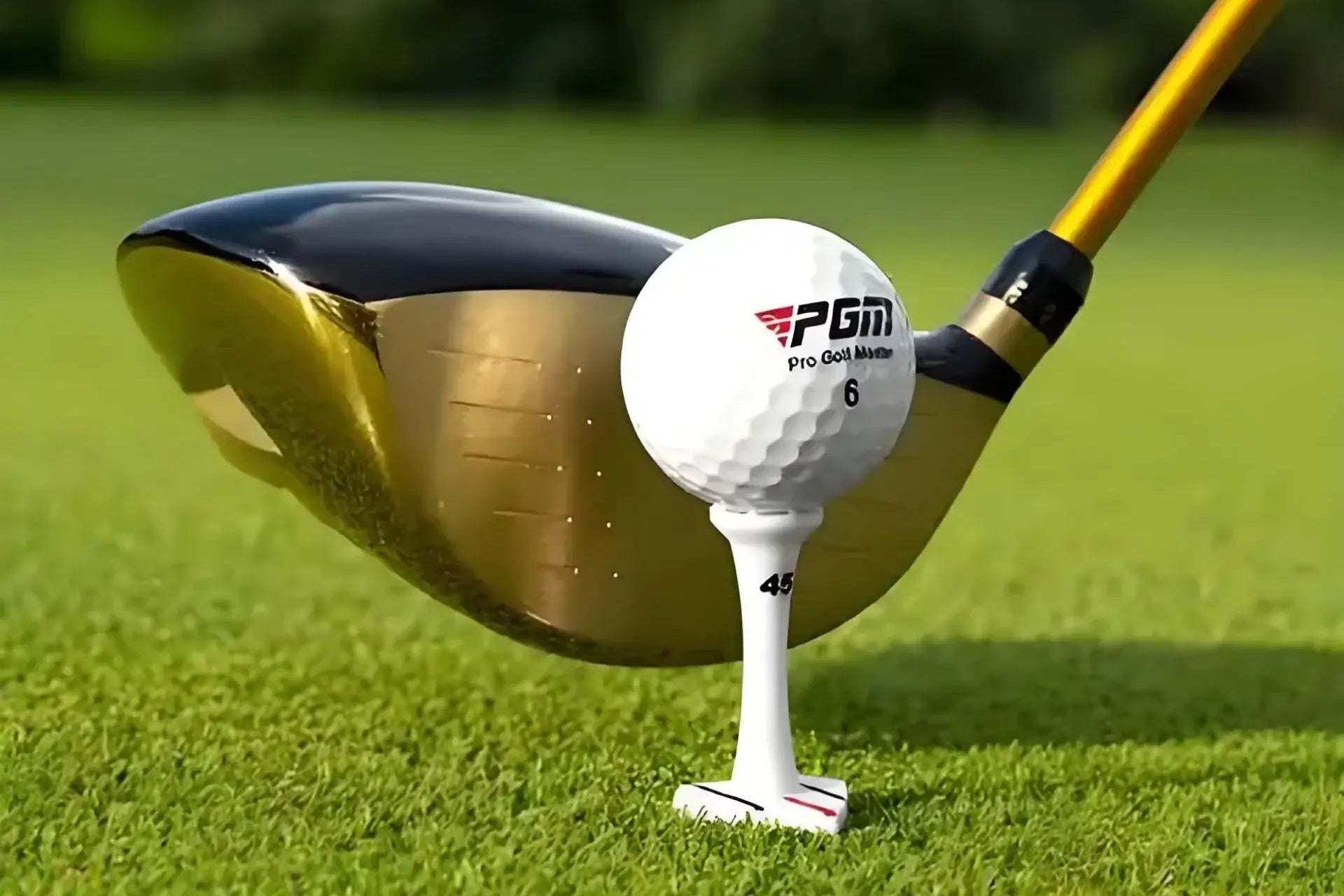 premium golf balls for competition training on tee with a driver club, showcasing tournament-grade performance.