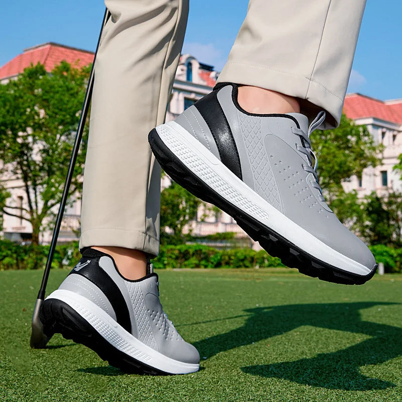 Unisex waterproof golf shoes in grey color, designed for comfort and performance on the golf course.