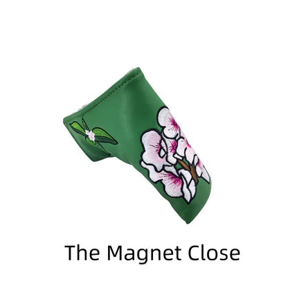 flower embroidery golf club head covers featuring a green design with delicate flower embroidery.