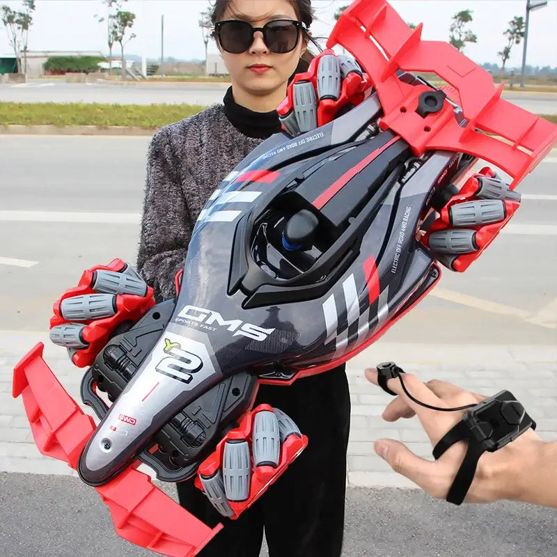 Y2 RC Car Drift Car with Light held by a person, showcasing its sleek design and vibrant red accents.