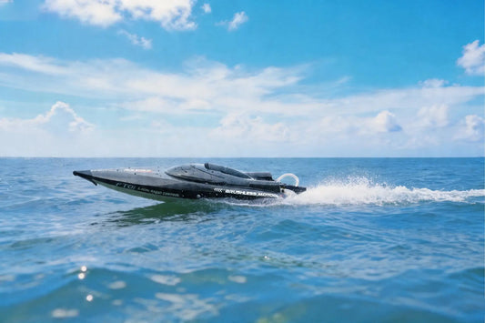 Large RC Speed Boat FT011 FT012 FT016 WL916 gliding across the water under a blue sky.