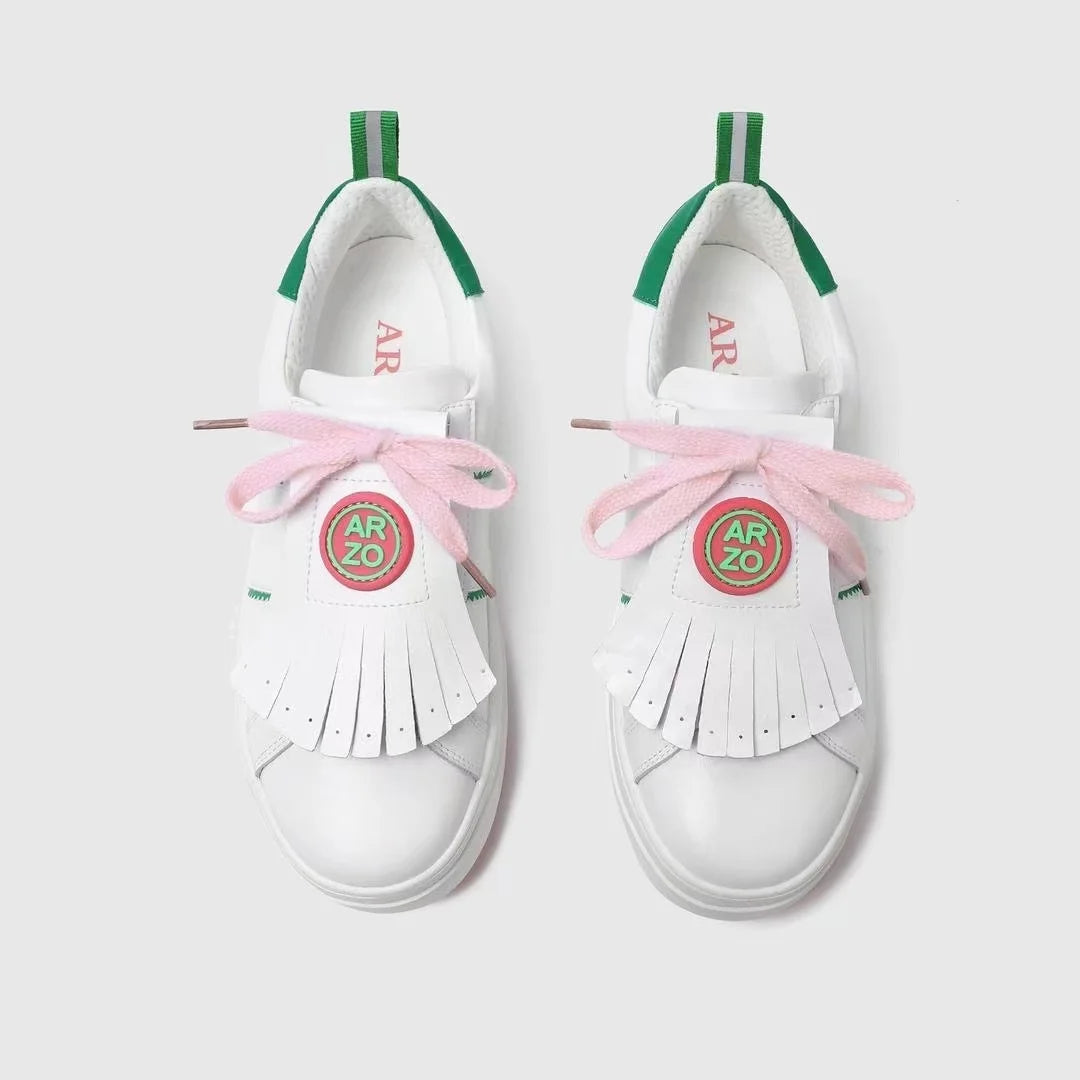 professional golf sneakers with pastel pink laces and unique fringe design, ideal for stylish performance on the course.