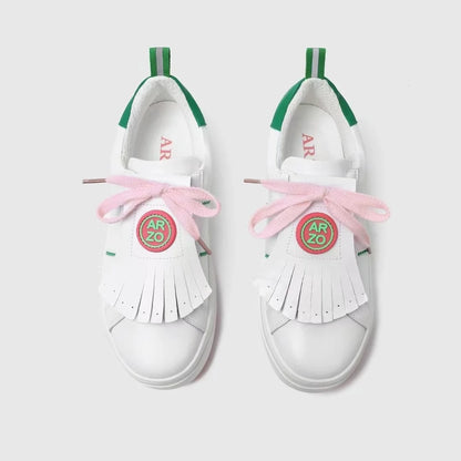 professional golf sneakers with pastel pink laces and unique fringe design, ideal for stylish performance on the course.