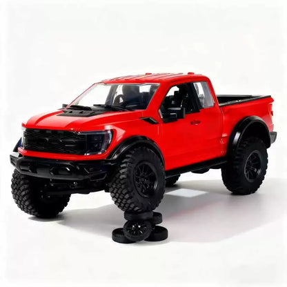 F-150 Raptor RC truck in vibrant red color showcasing rugged design and off-road tires.