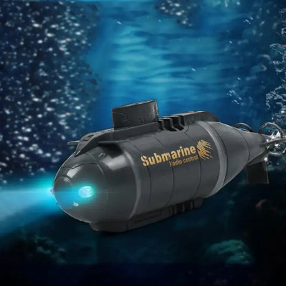 RC Submarine Dual Motor mini speedboat navigating underwater with a bright light.