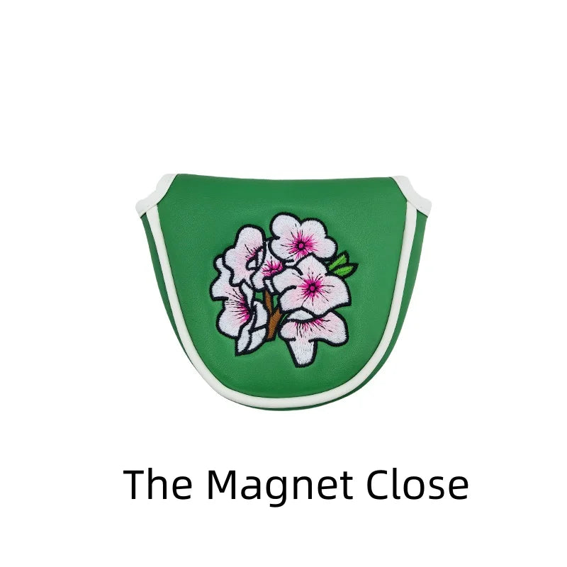 Flower embroidery golf club head covers in green with delicate floral design, perfect for protecting golf club heads.