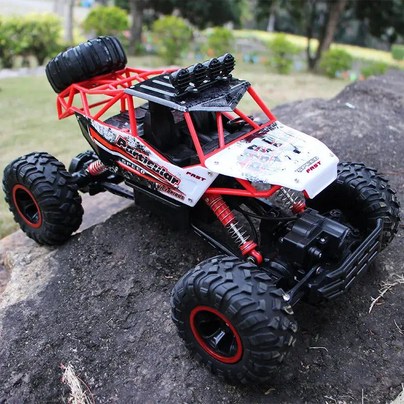 RC Car Remote Control Climbing Vehicle on rocky terrain, showcasing its all terrain capabilities and rugged design.