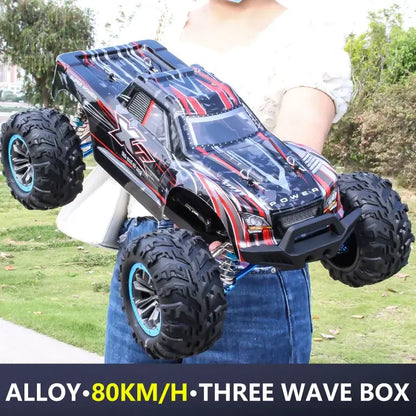 90kmh brushless rc racing car held by a person outdoors, showcasing its alloy design and powerful features.
