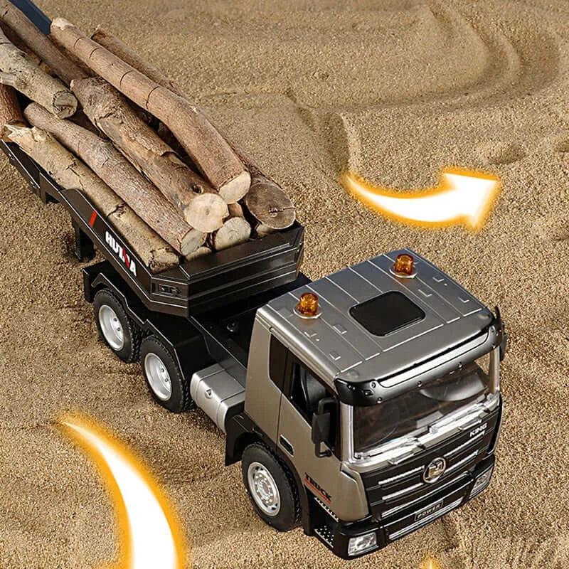 Huina RC Flat Truck Model carrying logs on a sandy surface, showcasing its detailed design and functionality.
