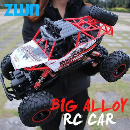 RC Car With Led Lights ZWN 1:12 4WD held by a person featuring a red and black design with large tires.