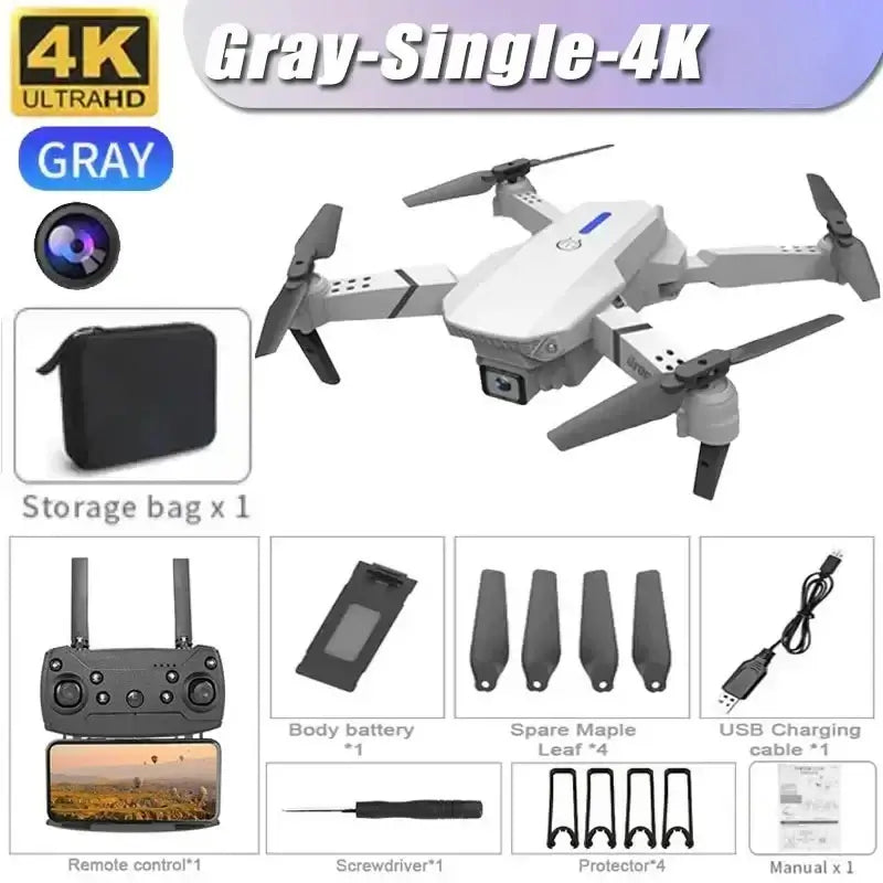 New E88 RC Drone in gray with 4K camera, remote control, storage bag, and accessories laid out for aerial photography.