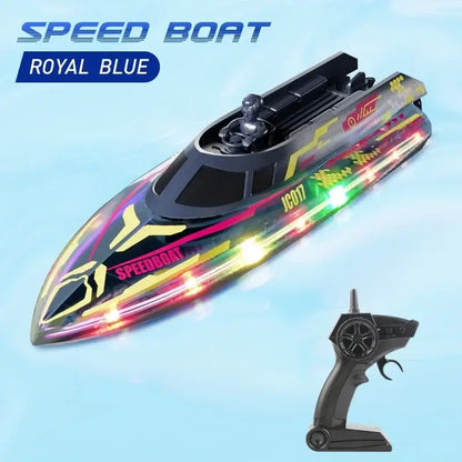 electric remote control speedboat with colorful lights and remote controller against a blue background