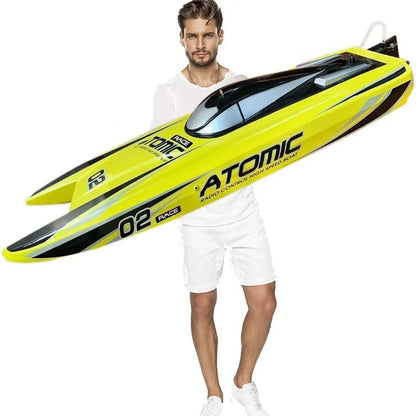 Large Remote Control Boat displayed by a man, showcasing its vibrant yellow color and sleek design, 27.6 inches long.