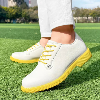 women's leather golf shoes in white with yellow accents, perfect for comfortable golfing on the course.