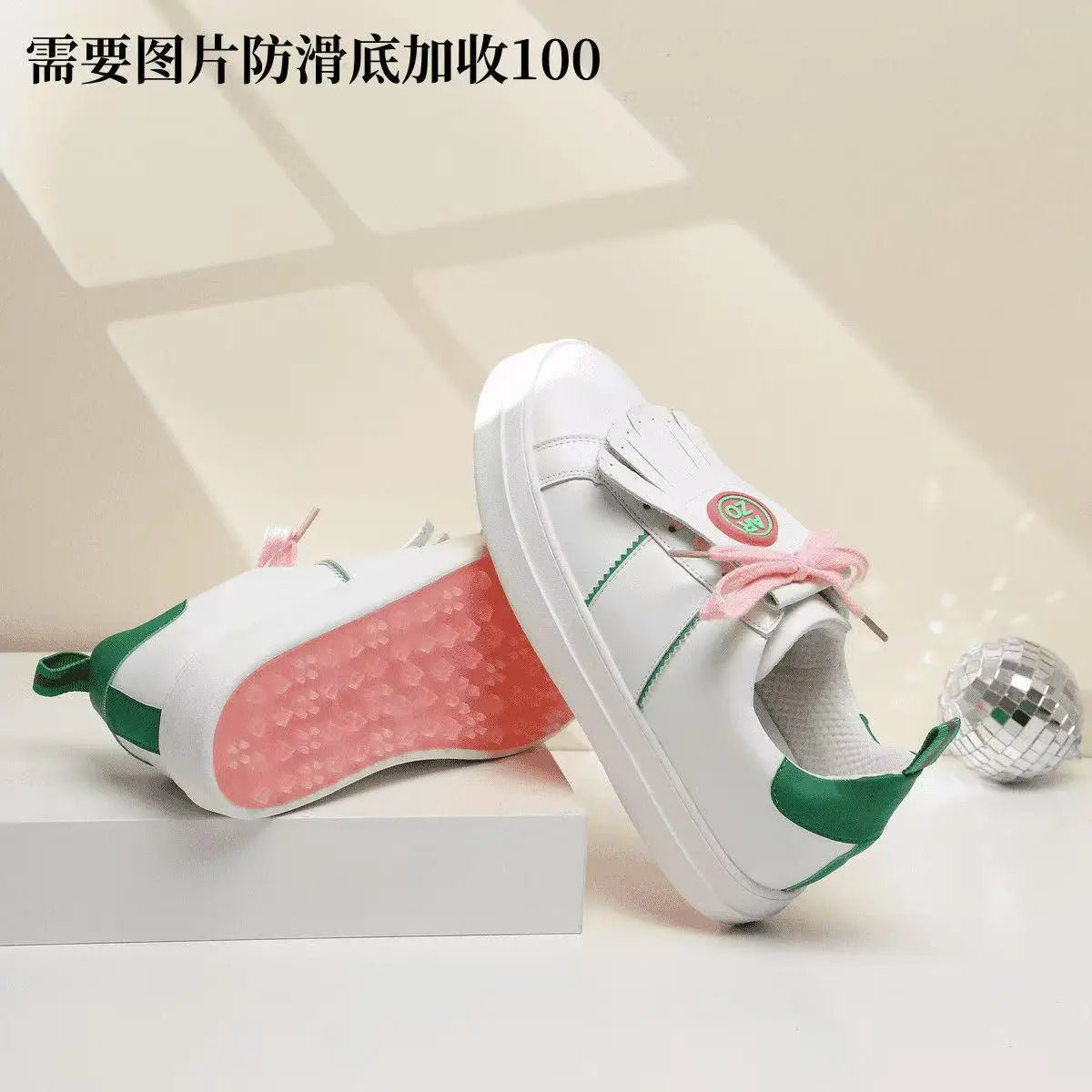Professional golf sneakers with green and pink accents, designed for comfort and stability during athletic activities.