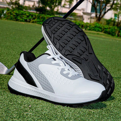 unisex waterproof golf shoes resting on grass, designed for comfort and performance in outdoor sports.
