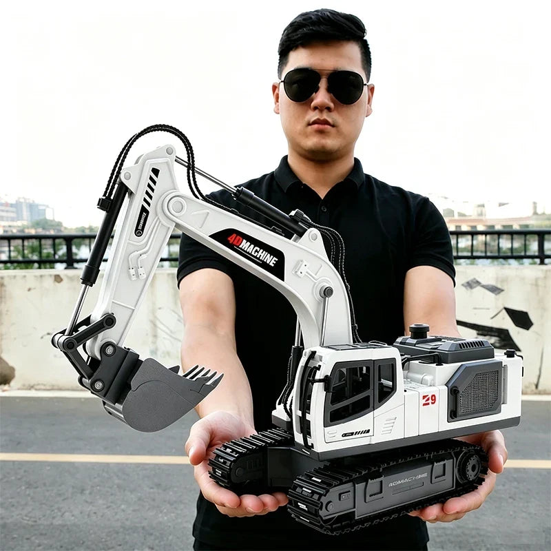 Excavator RC remote control model in white and black with detailed tracks and bucket held by person wearing black shirt and sunglasses