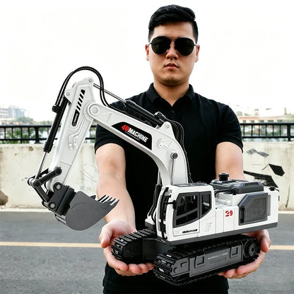 Excavator RC remote control model in white and black with detailed tracks and bucket held by person wearing black shirt and sunglasses