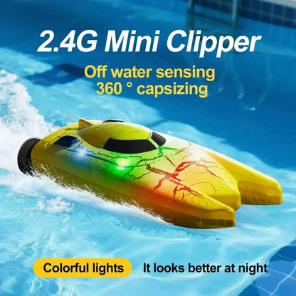 Mini RC boat with LED lights on water