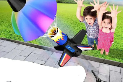 Motorized air rocket toy for kids launching outdoors with LED lights and parachute landing system