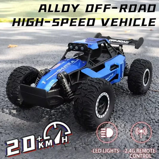 Off-Road RC Truck in blue and black with large rugged tires, alloy shocks, LED lights, and rear spoiler for high-speed all-terrain use