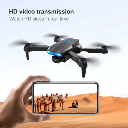 PRO MAX foldable drone E88 compact black plastic quadcopter with dual cameras capturing HD video shown on smartphone
